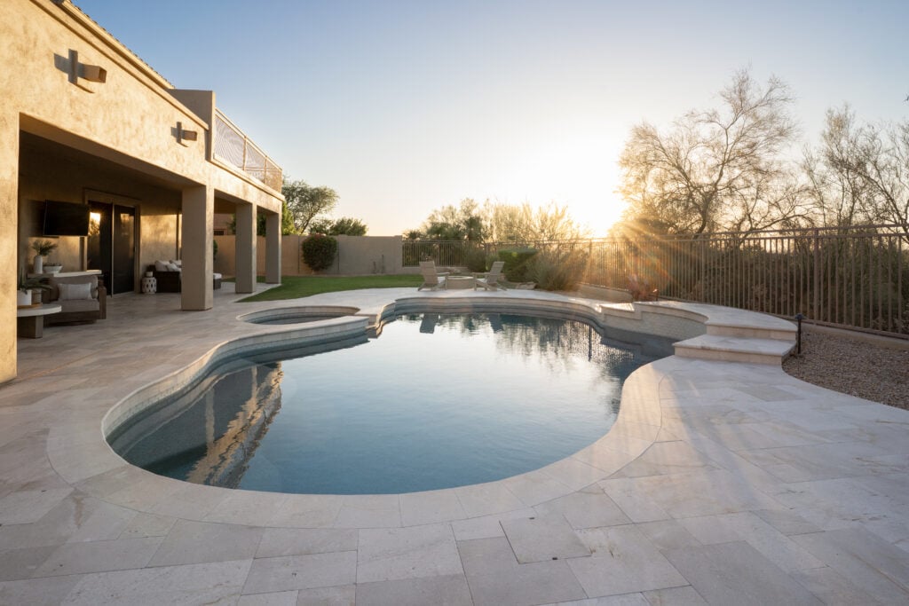 Stelse Residence — travertine pool deck at sunset